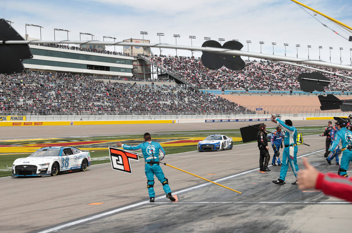 Drivers make their way out of pit road before the start of the Pennzoil 400 NASCAR Cup Series r ...