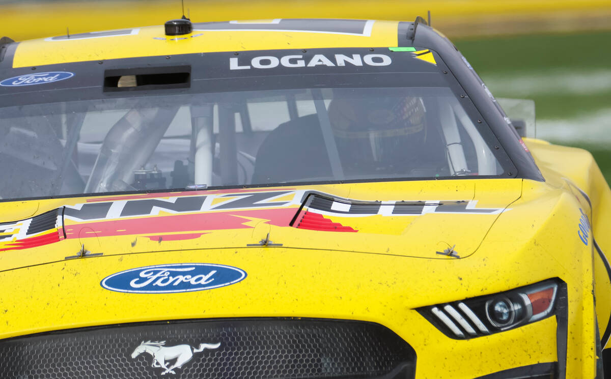 Driver Joey Logano leaves the track after bouncing off a wall during the Pennzoil 400 NASCAR Cu ...