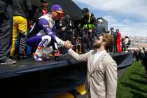 Bryce Harper, grand marshal for the Pennzoil 400 NASCAR Cup Series race, right, greets driver D ...