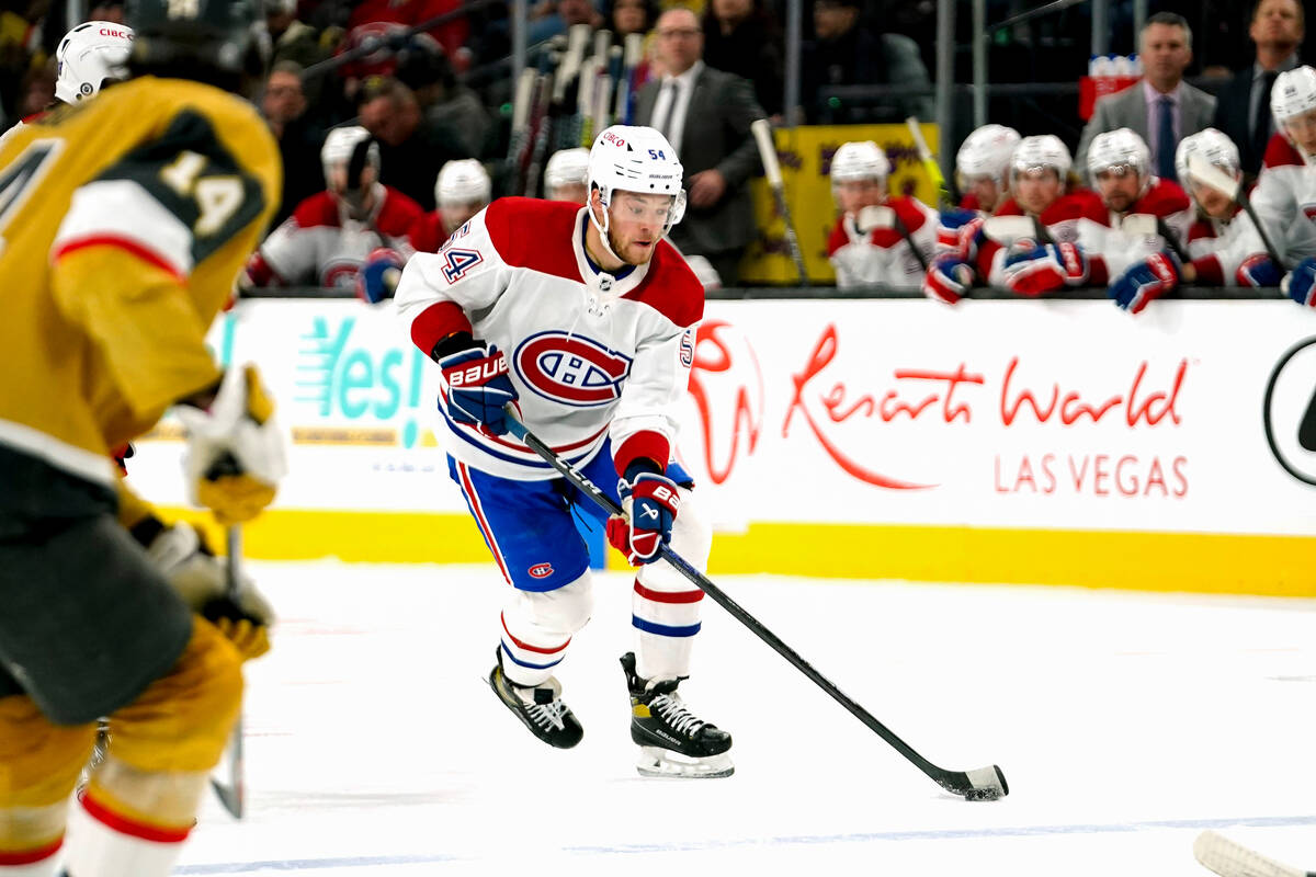 Montreal Canadiens defenseman Jordan Harris skates with the puck during the third period of an ...