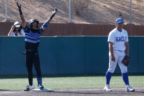 Basic's Ty Southisene (3) gestures after he reached the third base as Bishop Gorman's Gunnar My ...