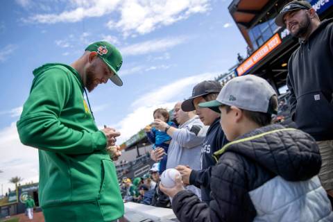 The Oakland Athletics’ Paul Blackburn signs autographs before an MLB exhibition game aga ...