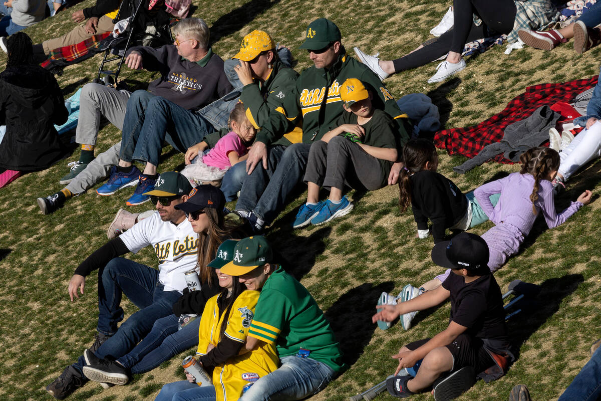 Oakland Athletics fans watch from the outfield seating during an MLB exhibition game against th ...