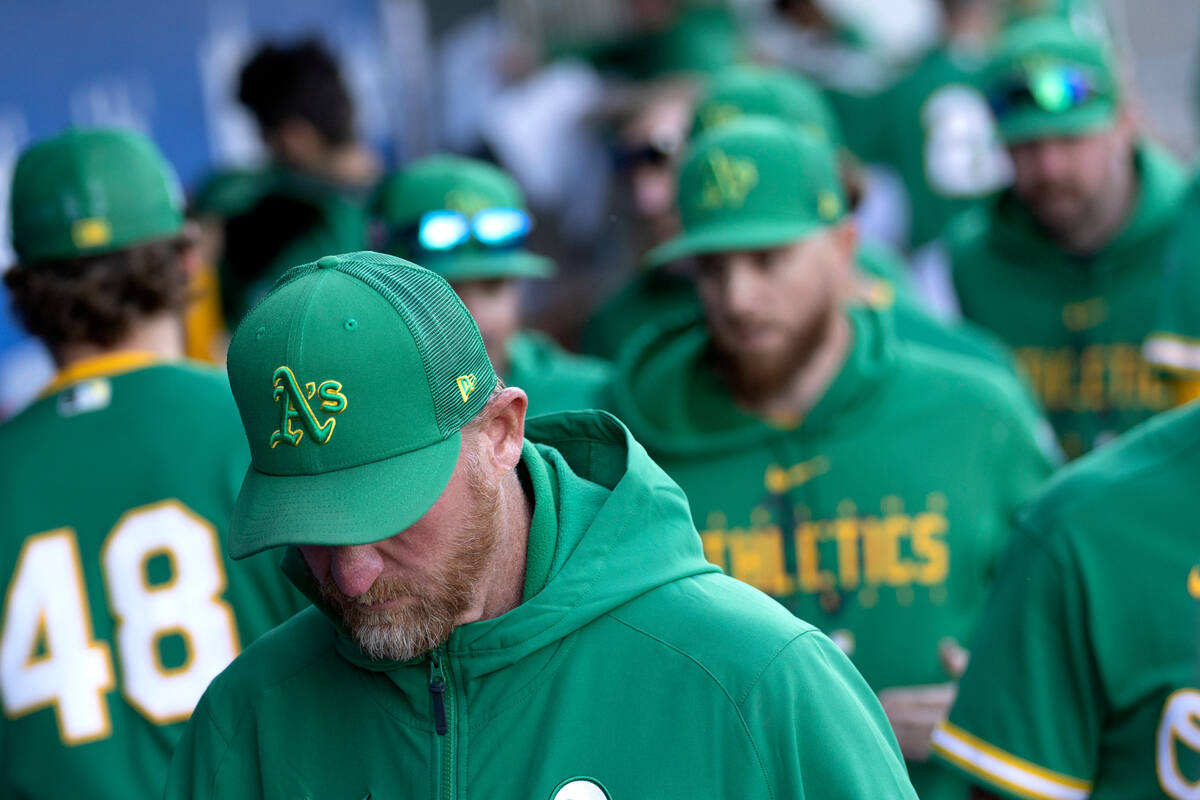 Oakland Athletics pitching coach Scott Emerson leaves the dugout after an MLB exhibition game a ...