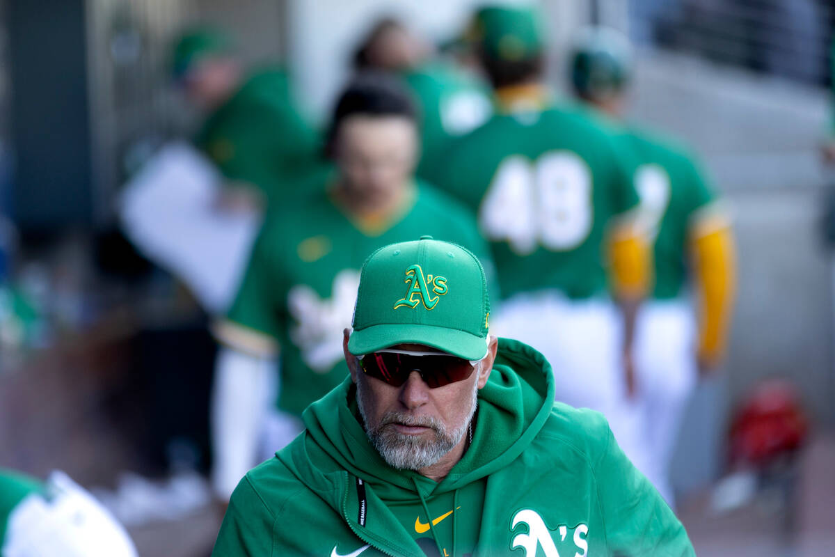 Oakland Athletics manager Mark Kotsay leaves the dugout after an MLB exhibition game against th ...