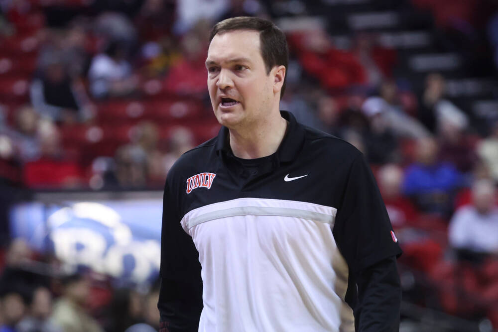 UNLV head coach Kevin Kruger talks toward the bench during the second half of a basketball game ...