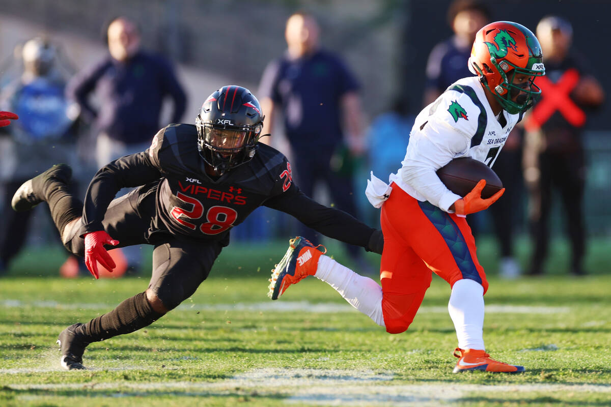 Vegas Vipers outside linebacker C.J. Avery (28) tackles Seattle Sea Dragons wide receiver Jahco ...