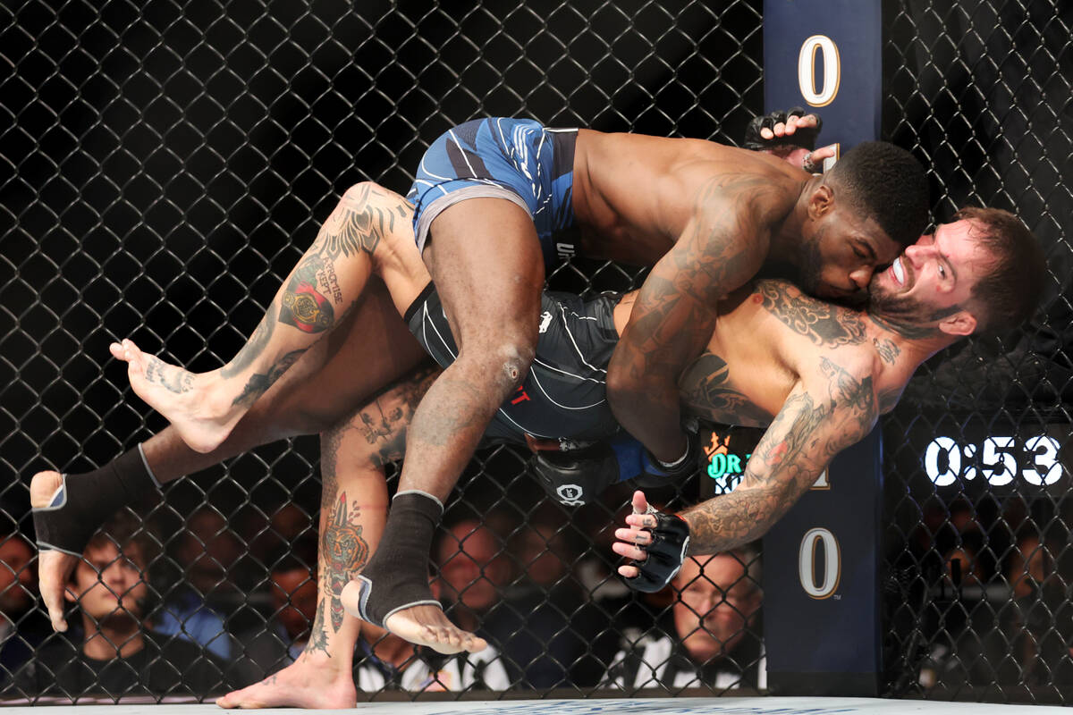 Trevin Jones, left, takes down Cody Garbrandt during a UFC 285 bantamweight fight at T-Mobile A ...
