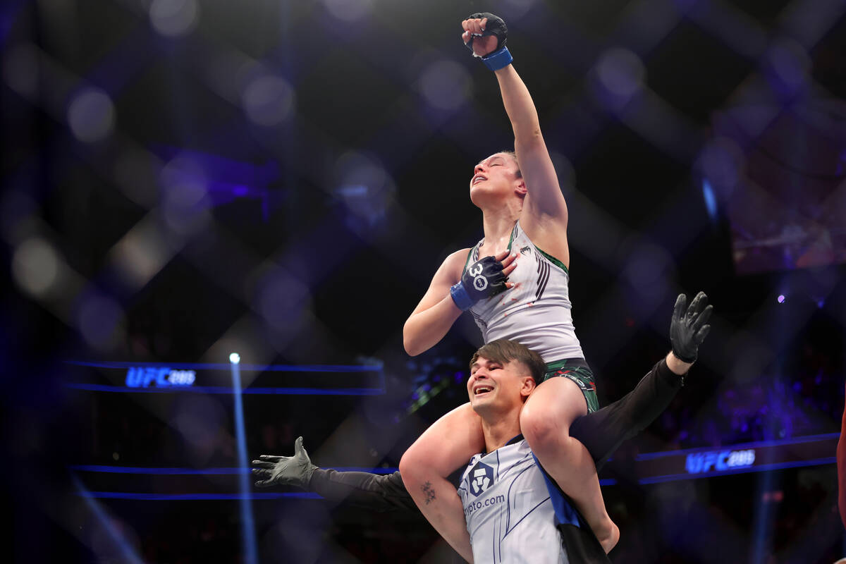 Alexa Grasso celebrates her fourth round submission victory against Valentina Shevchenko in a w ...