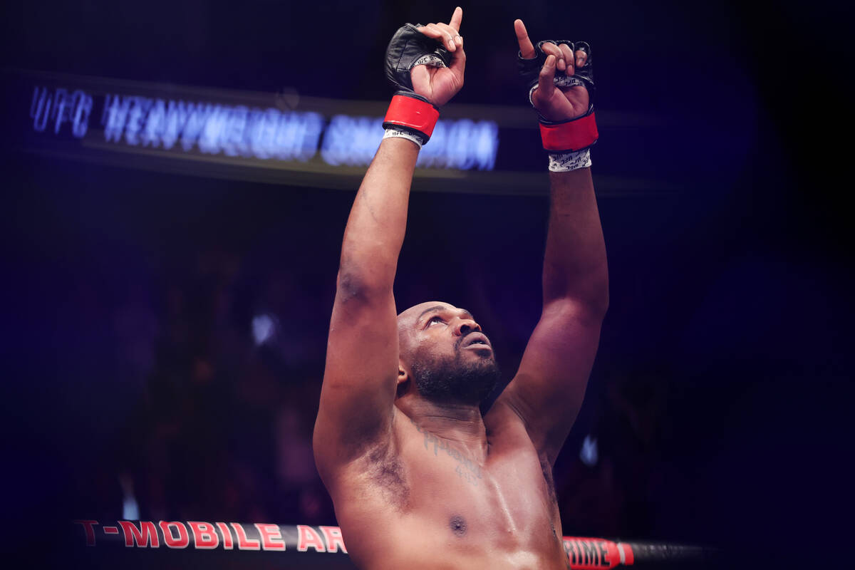 Jon Jones reacts after submitting Ciryl Gane in the first round of a heavyweight title bout dur ...