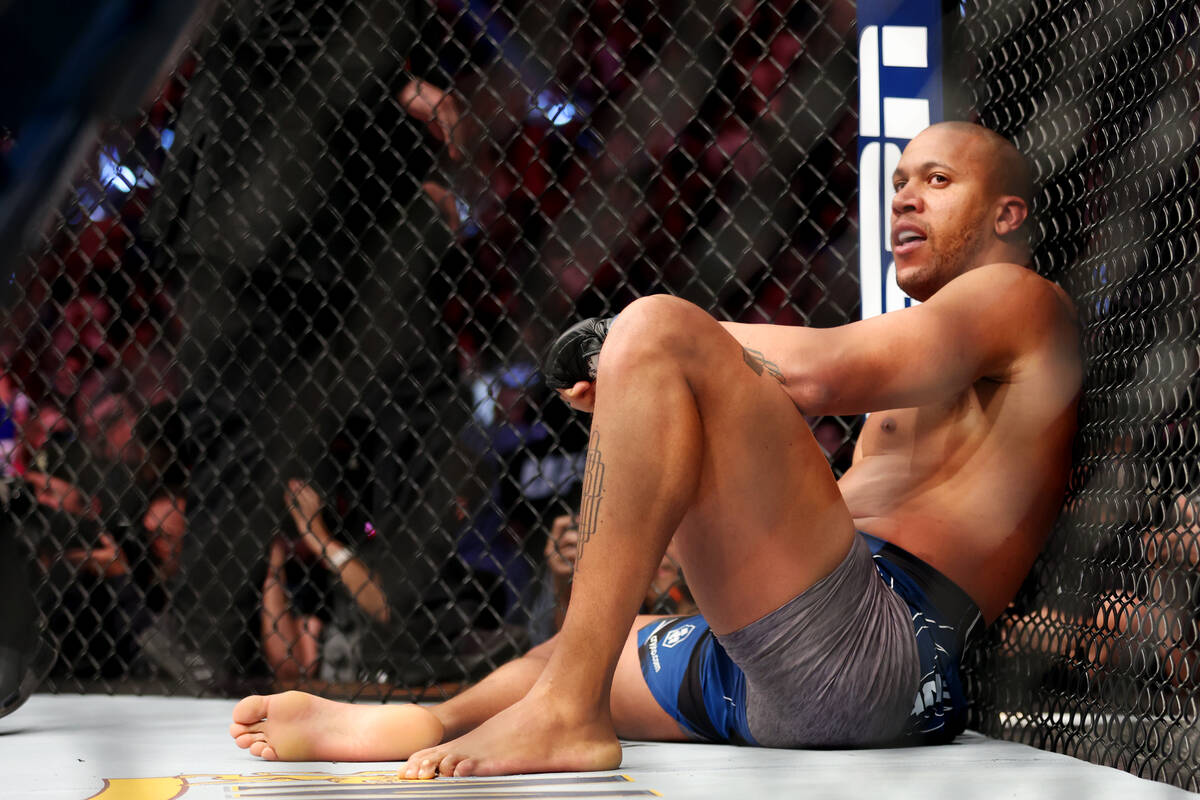 Ciryl Gane reacts after losing by way of submission against Jon Jones in the first round of a h ...