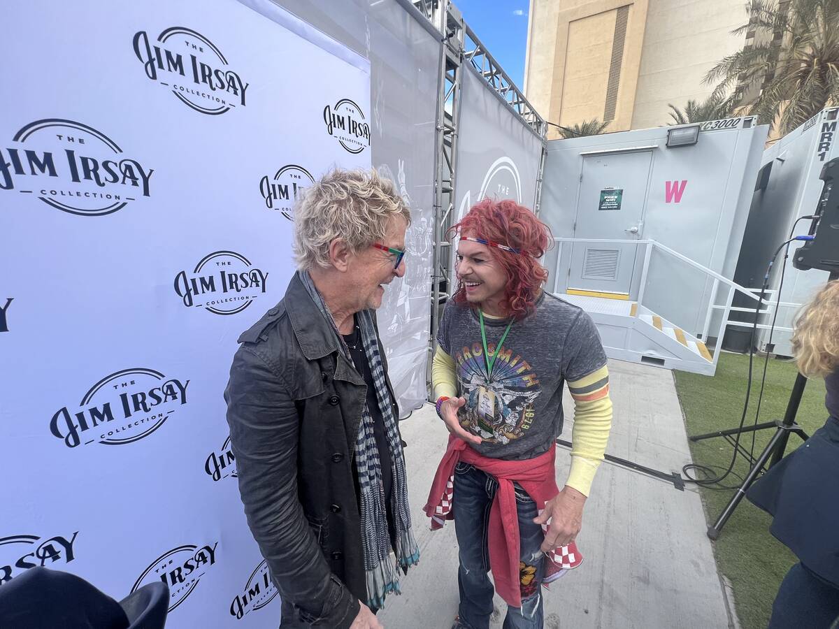 Kevin Cronin of REO Speedwagon, left, and Carrot Top are shown before the Jim Irsay Collection ...