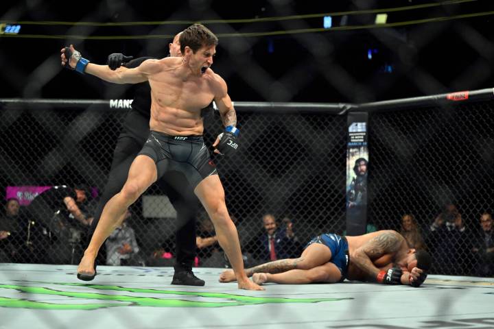 Actor Jake Gyllenhaal, left, is held back by a referee after "knocking down" actor Ja ...