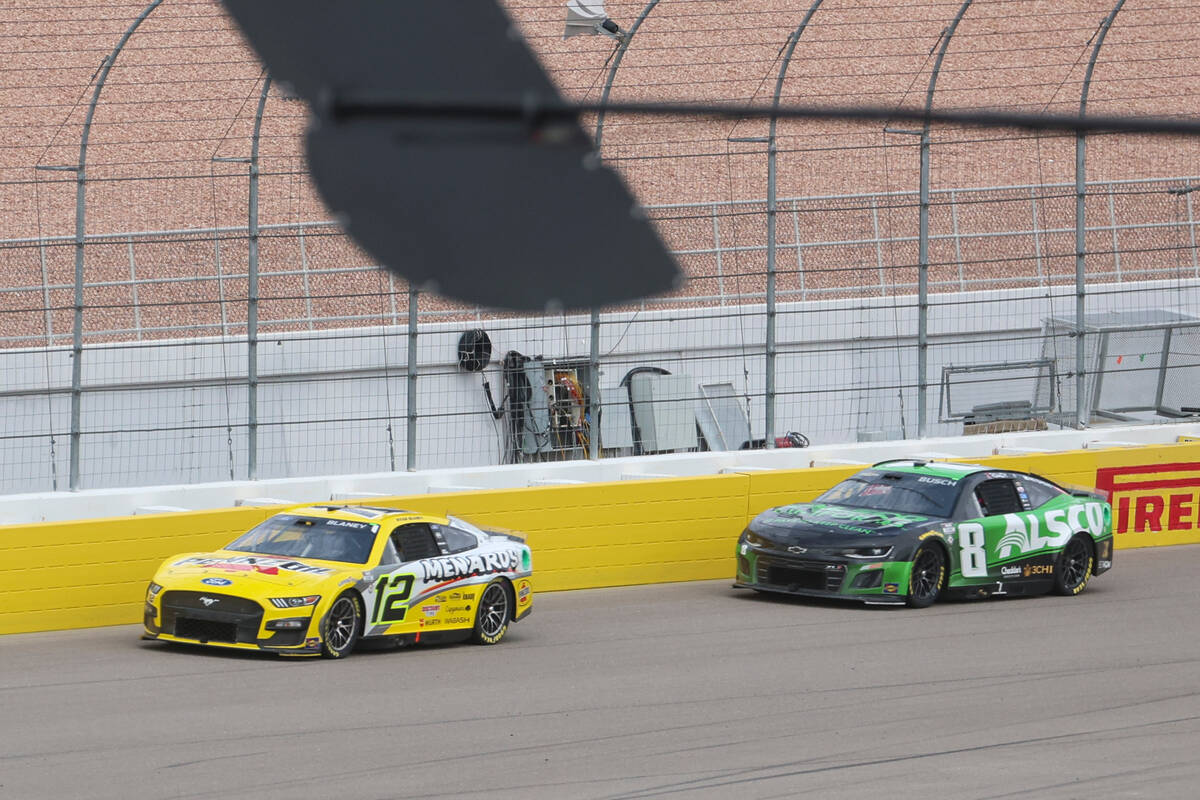 Driver Ryan Blaney (12) drives ahead of Kyle Busch (8) during the Pennzoil 400 NASCAR Cup Serie ...