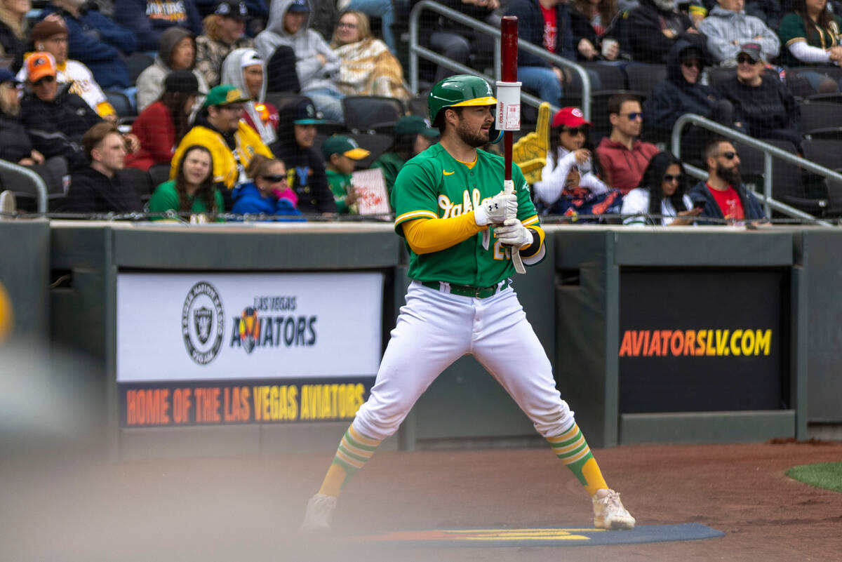 Oakland Athletics designated hitter Shea Langeliers (23) warms up in the on deck circle during ...