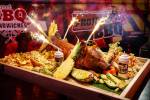 Hogstravaganza! Party platter features a whole hog, sparklers, horns and music