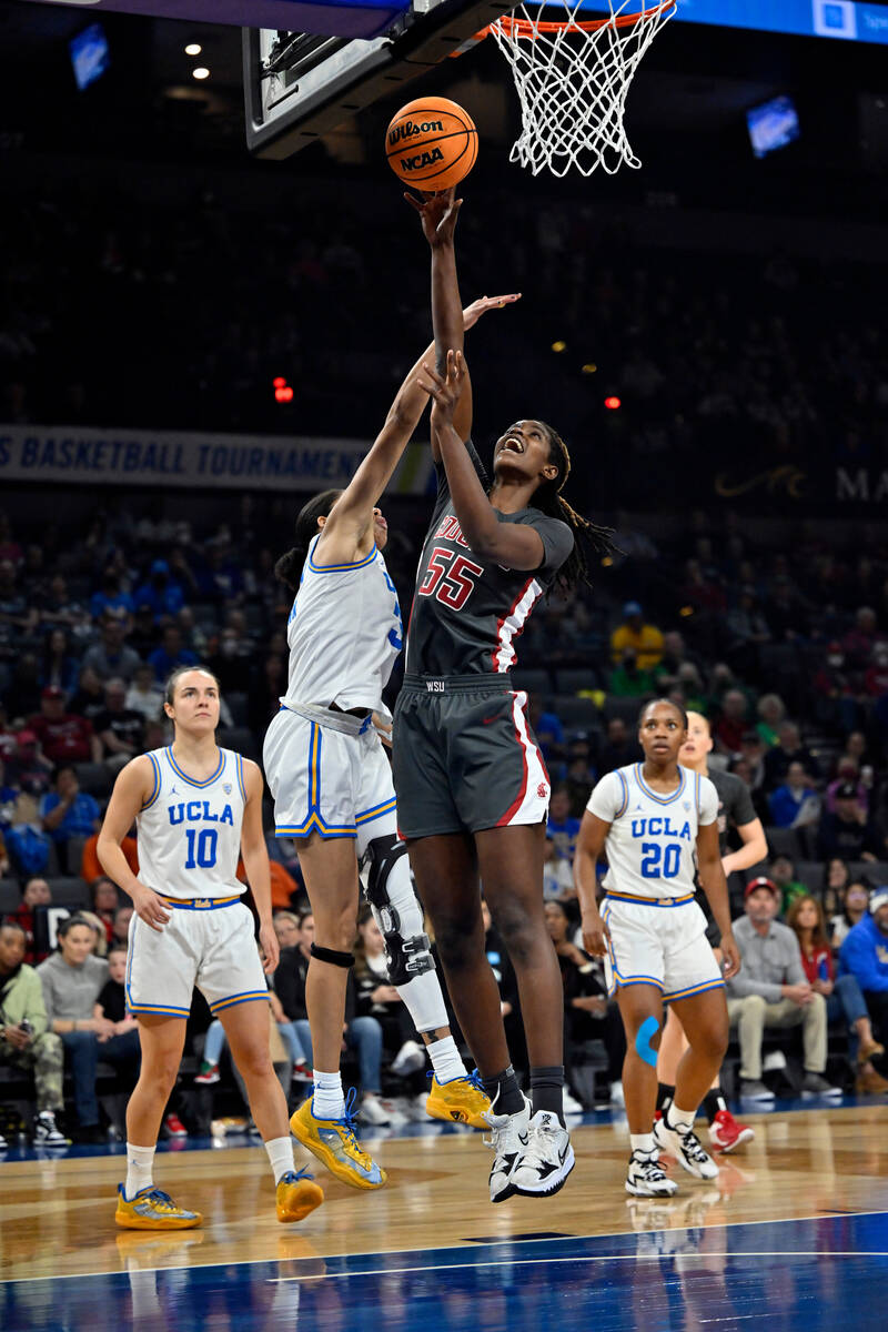 Washington State center Bella Murekatete (55) shoots against UCLA guard Camryn Brown during the ...
