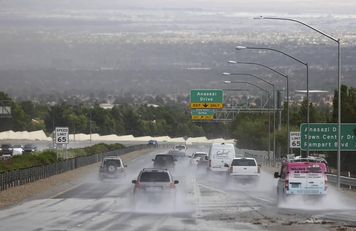 Vehicles travel on Summerlin Parkway as rain comes down over the Las Vegas Valley on July 26, 2 ...