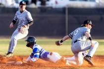 Basic High's Tate Southisene is tagged out by Faith Lutheran's George Holt (15) at second durin ...