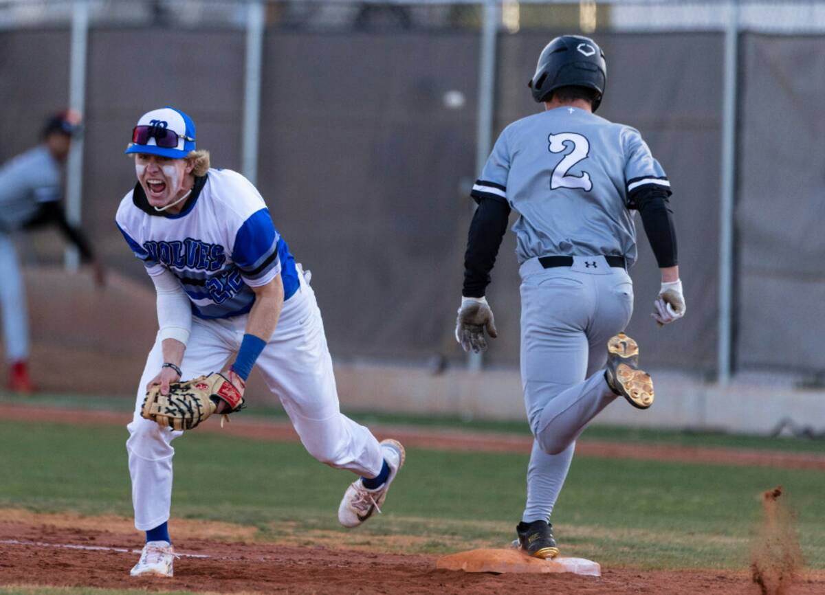 Basic High's Cooper Sheff reacts after he forced Faith Lutheran's Caden Richards out at first d ...