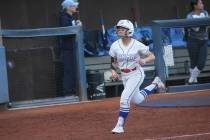 Bishop Gorman's Allie Bernardo heads to home base to score a run against Centennial during a so ...