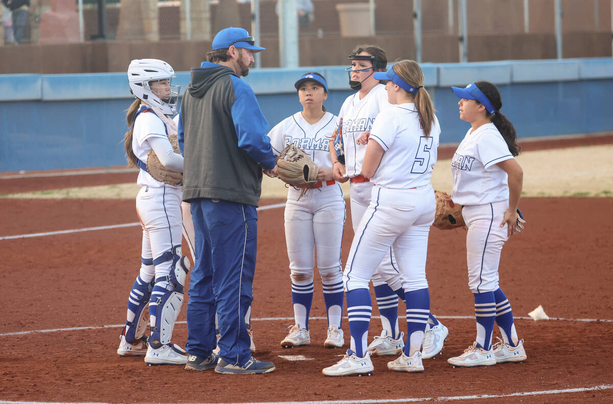Bishop Gorman's head coach Kevin Smith talks with his team during a softball game against Cente ...