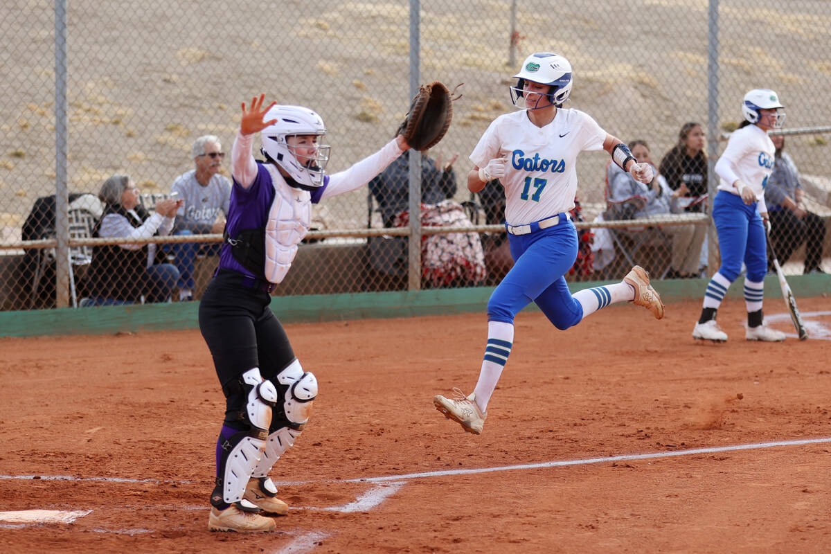 Green Valley's Mikee Morris (17) runs home for a run during a softball game against Silverado a ...