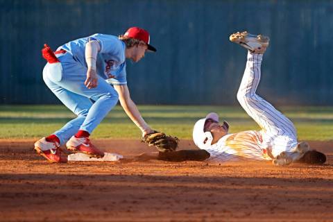 Desert Oasis’ Lincoln Guillermo, right, is tagged out by Liberty’s Konner Brown ...