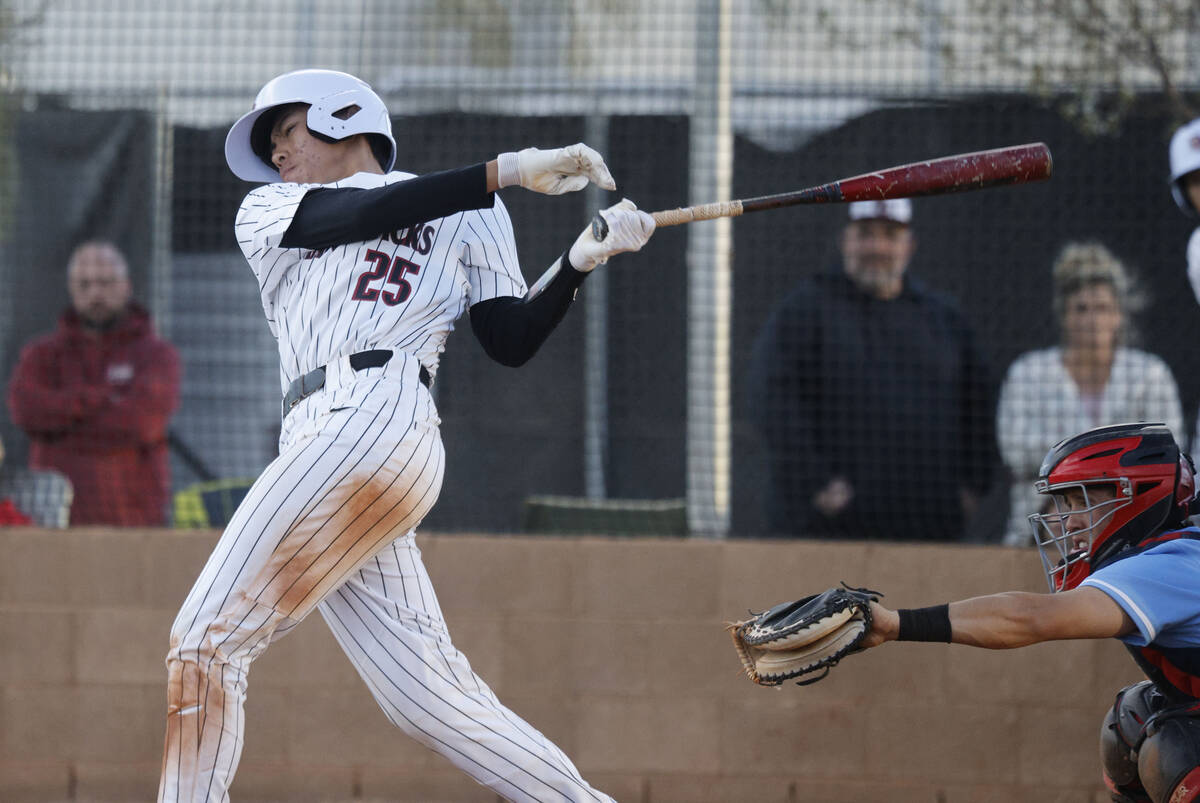 Desert Oasis’ Joell Castro hits an RBI double during the fifth inning of a baseball game ...
