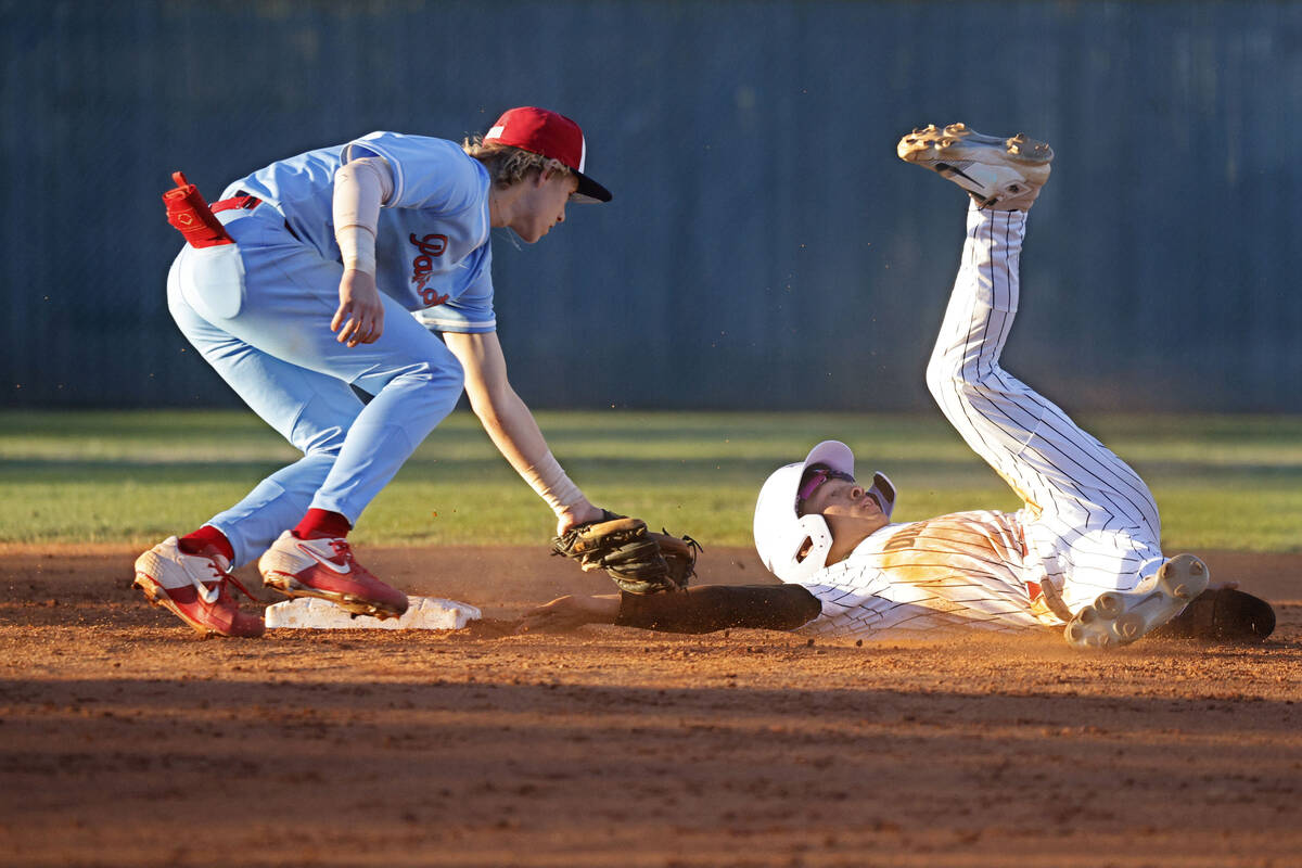 Desert Oasis’ Lincoln Guillermo, right, is tagged out by Liberty’s Konner Brown ...