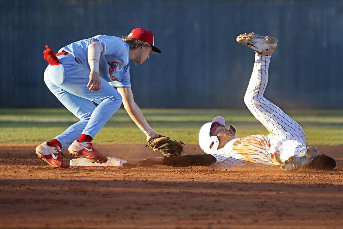 Desert Oasis’ Lincoln Guillermo, right, is tagged out by Liberty’s Konner Brown ...
