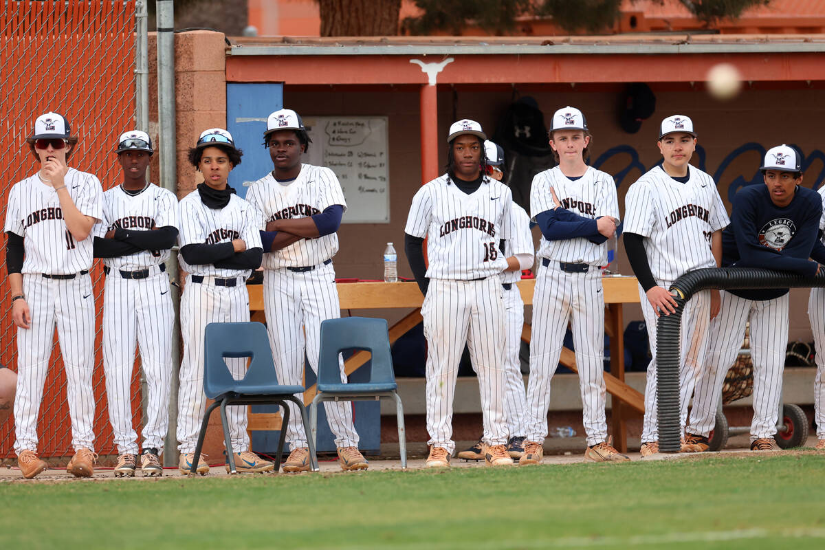 Legacy players watch a pitch by Palo Verde against their teammate during a baseball game at Leg ...