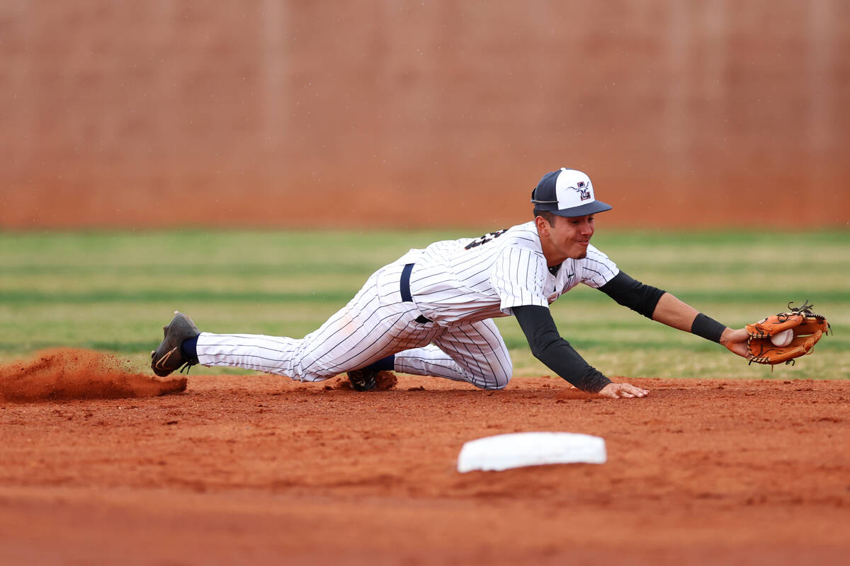 Legacy's Javier Salas (10) grabs a ground ball during a baseball game at Palo Verde High School ...
