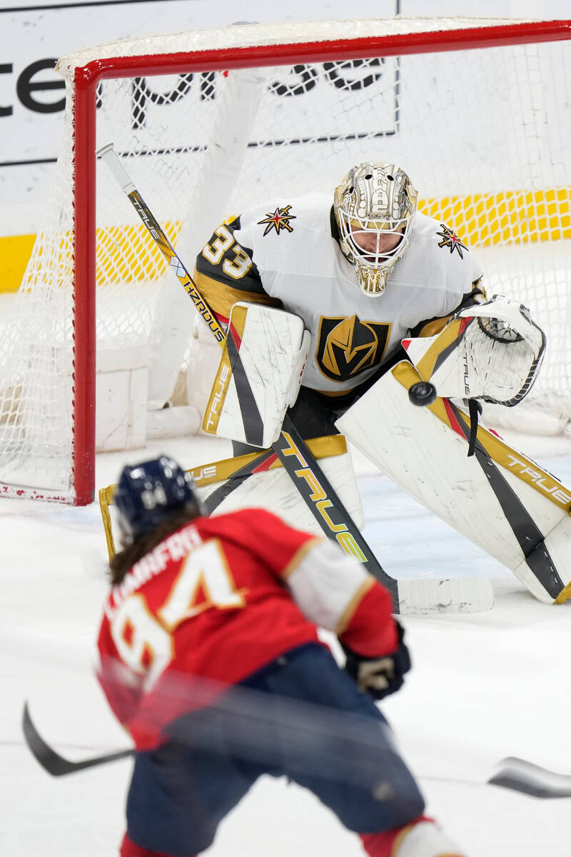 Florida Panthers left wing Ryan Lomberg (94) attempts a shot at Vegas Golden Knights goaltender ...