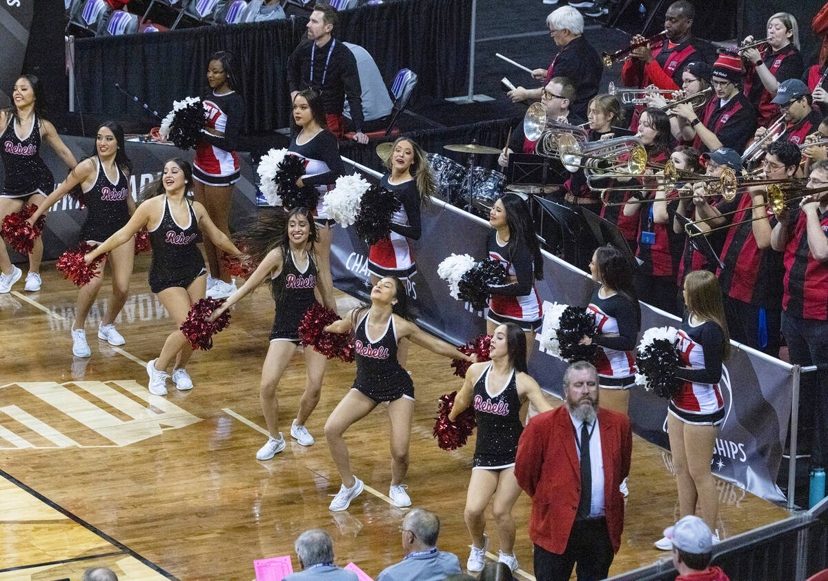 UNLV cheerleaders perform during the Mountain West tournament between Lady Rebels and Nevada Wo ...