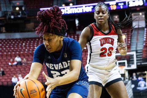 Nevada Wolf Pack forward Lexie Givens (23) recovers a rebound ball as UNLV Lady Rebels center D ...