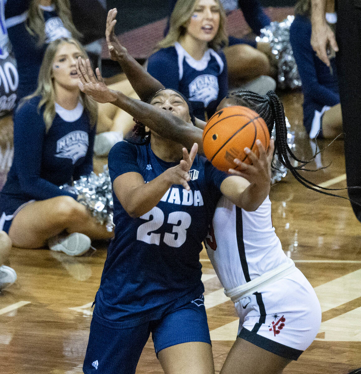 Nevada Wolf Pack forward Lexie Givens (23) tries to shoot for the basket as UNLV Lady Rebels ce ...