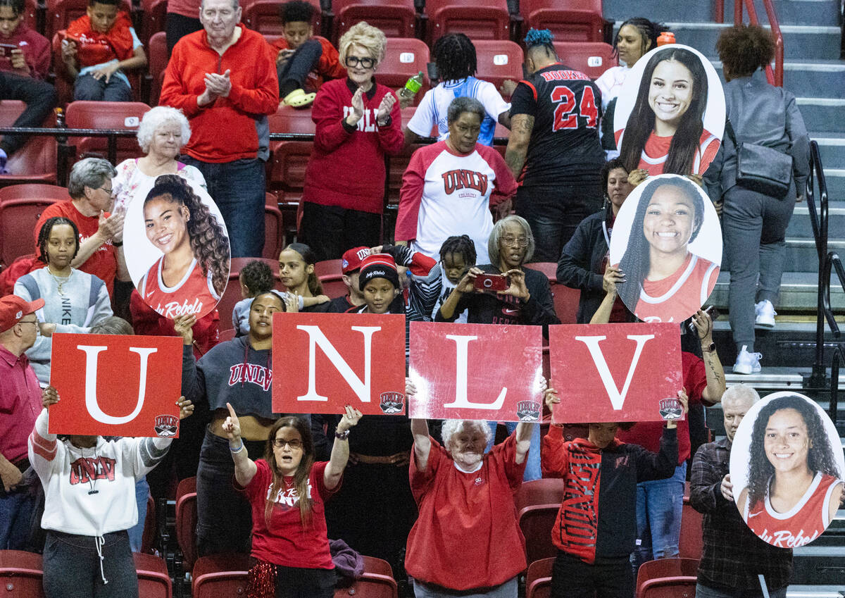 UNLV Lady Rebels fans cheer for their team during the second half of the Mountain West tourname ...