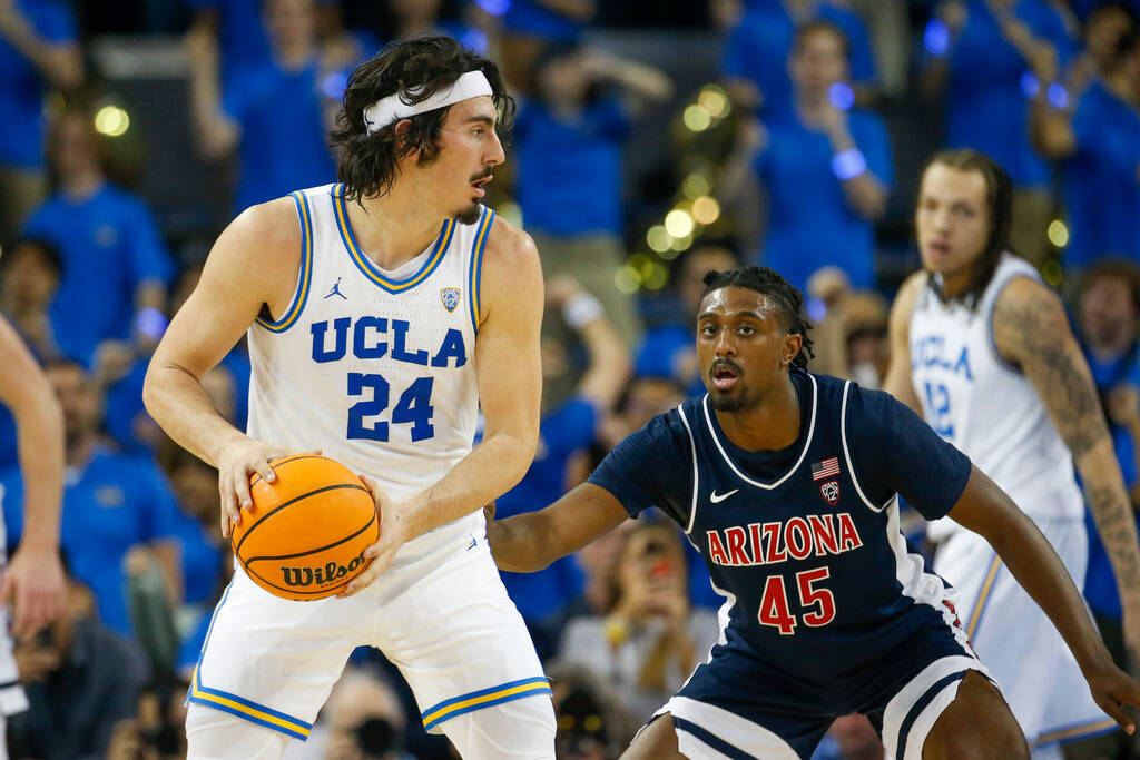 UCLA guard Jaime Jaquez Jr. (24) is defended by Arizona guard Cedric Henderson Jr. (45) during ...