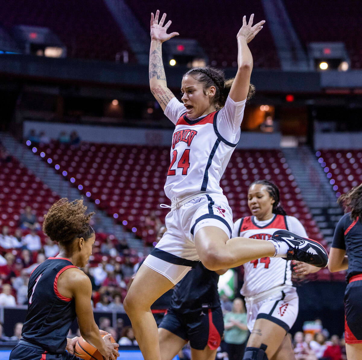 San Diego State guard Asia Avinger (1) attempts to get off a pass under tough defense by UNLV g ...