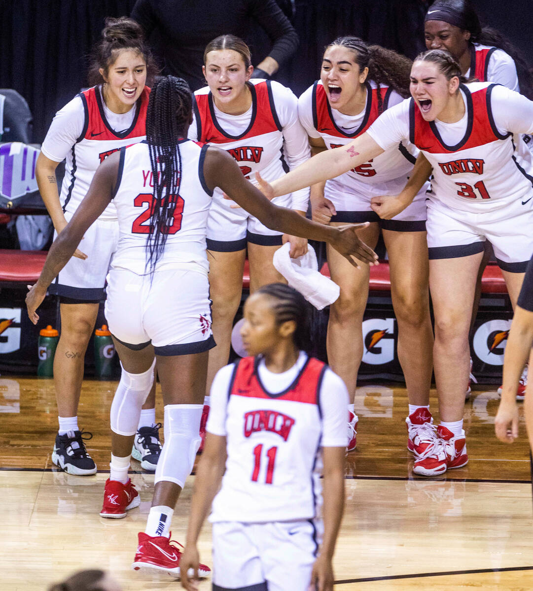 UNLV center Desi-Rae Young (23) is congratulated by teammates after another big basket against ...