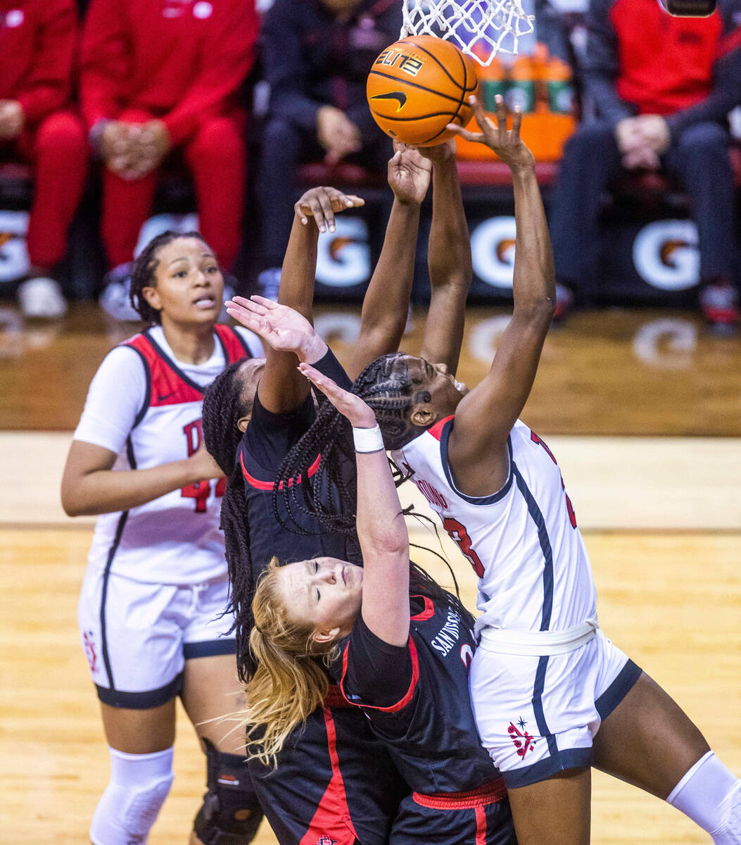 UNLV center Desi-Rae Young (23) gets off a shot after a rebound over San Diego State guard Abby ...