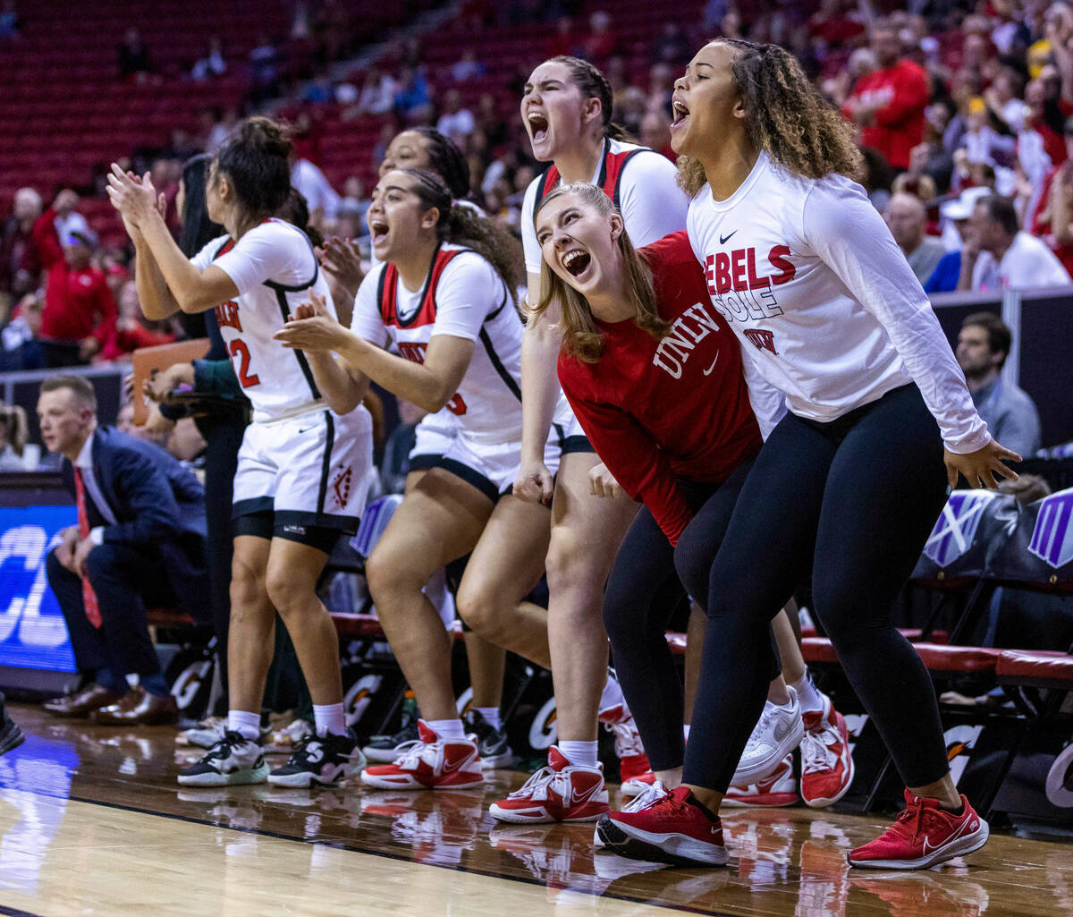 The UNLV bench explodes with excitement as they edge out San Diego State during the second half ...