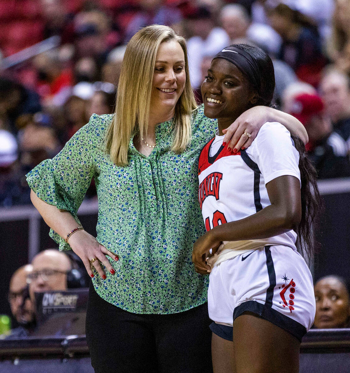 UNLV head coach Lindy La Rocque chats with guard Jasmyn Lott (10) as she waits to enter the gam ...