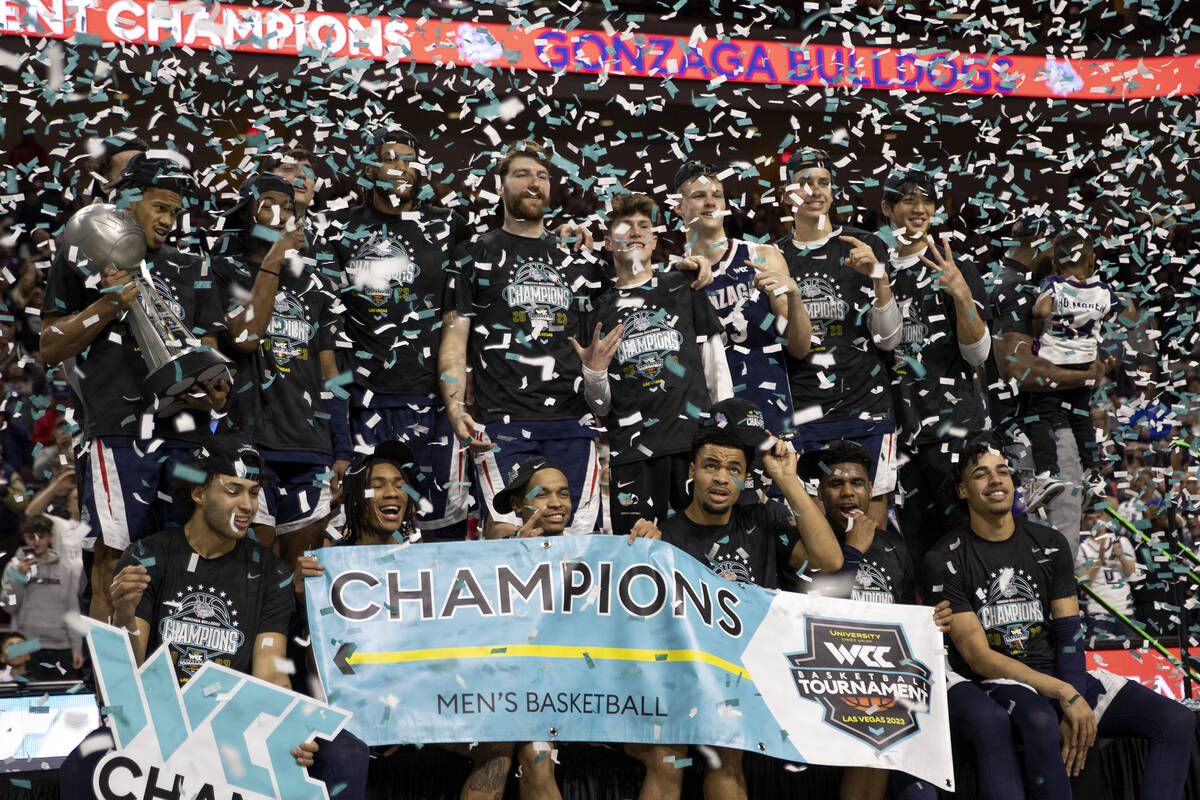 The Gonzaga Bulldogs are showered with confetti after winning a West Coast Conference menȁ ...