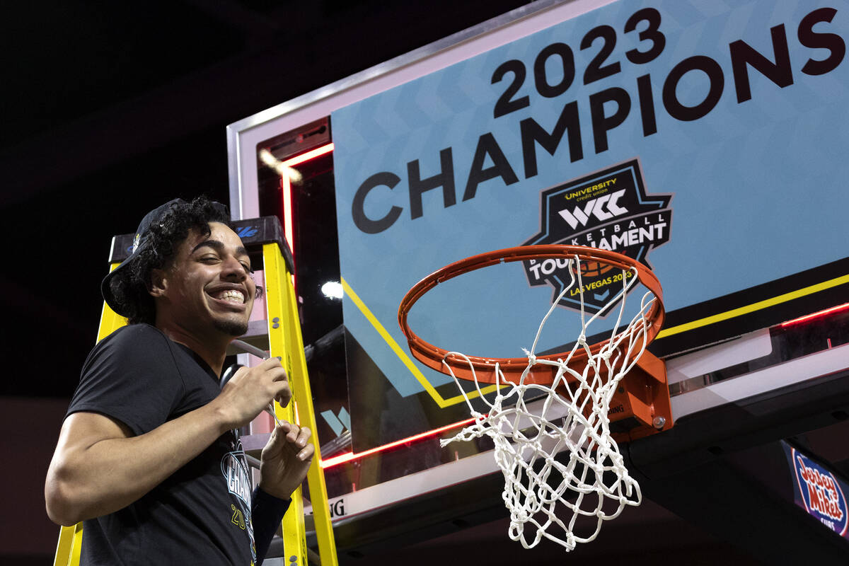 Gonzaga Bulldogs guard Julian Strawther smiles after cutting the net after the Bulldogs won a W ...
