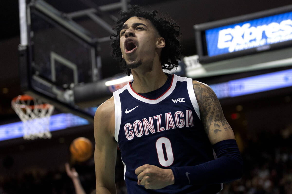 Gonzaga Bulldogs guard Julian Strawther (0) celebrates after referees called a foul on the St. ...