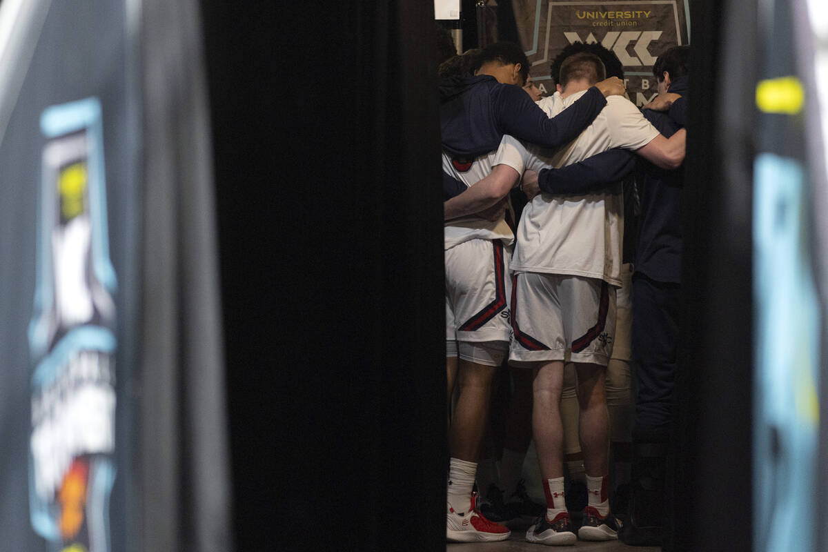 The St. Mary's Gaels huddle before taking the court for a West Coast Conference men’s ba ...