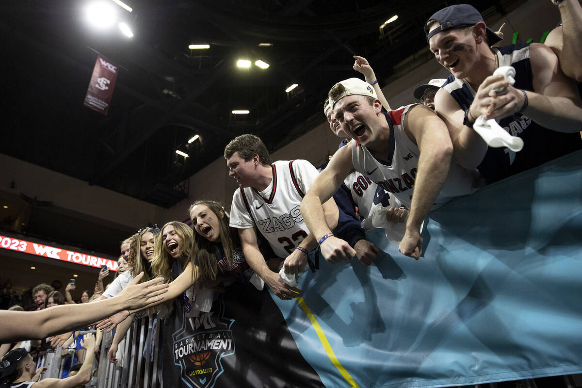 Gonzaga Bulldogs fans greet their team after the Bulldogs won a West Coast Conference menȁ ...