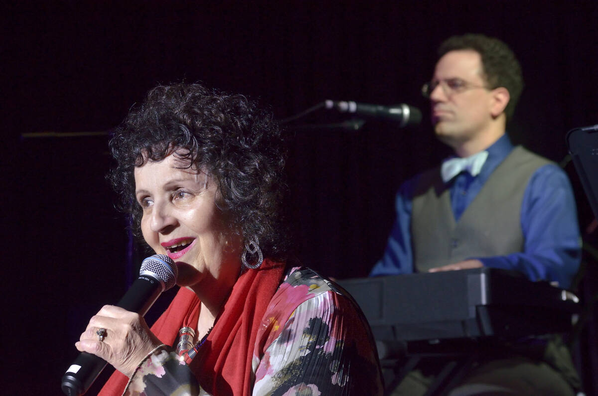 Rita Davidsen sings as her son Kenny Davidsen plays piano at the TSpot Lounge in the Tuscany ho ...